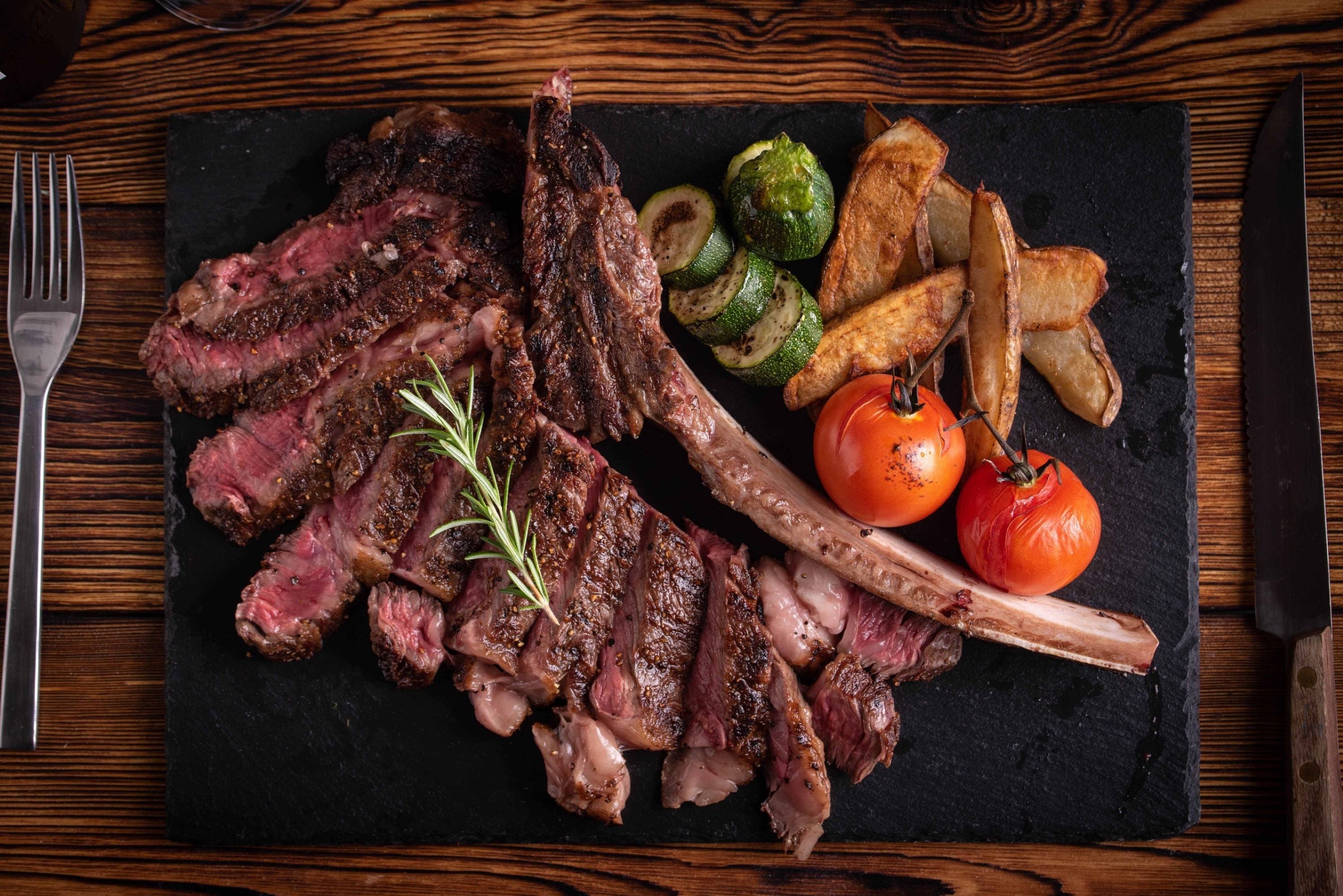 Futari Wagyu Tomahawk, sliced and served with grilled vegetables